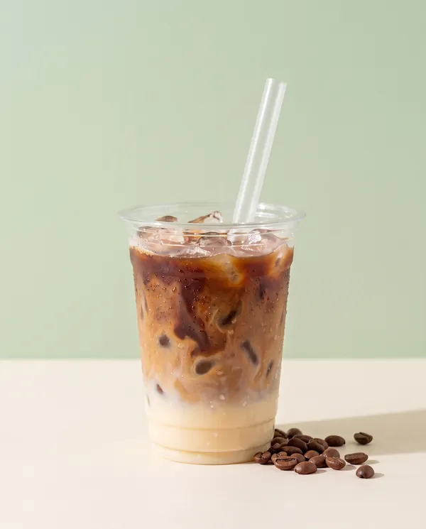 Vietnamese iced coffee swirling into sweetened condensed milk